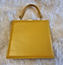 Custard yellow patent top handle bag